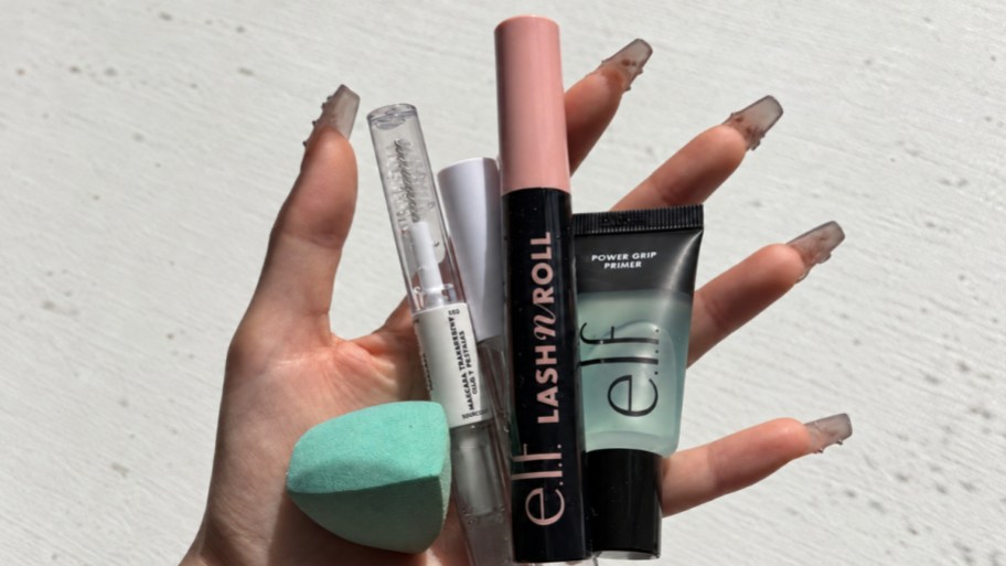 a hand holding elf all day every day face kit items