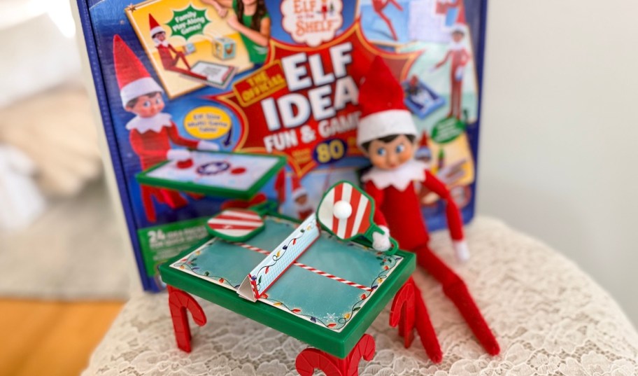 elf on the shelf with ping pong paddles and box of ideas