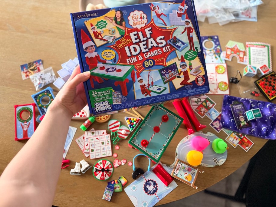 hand holding elf on the shelf ideas props and games kit