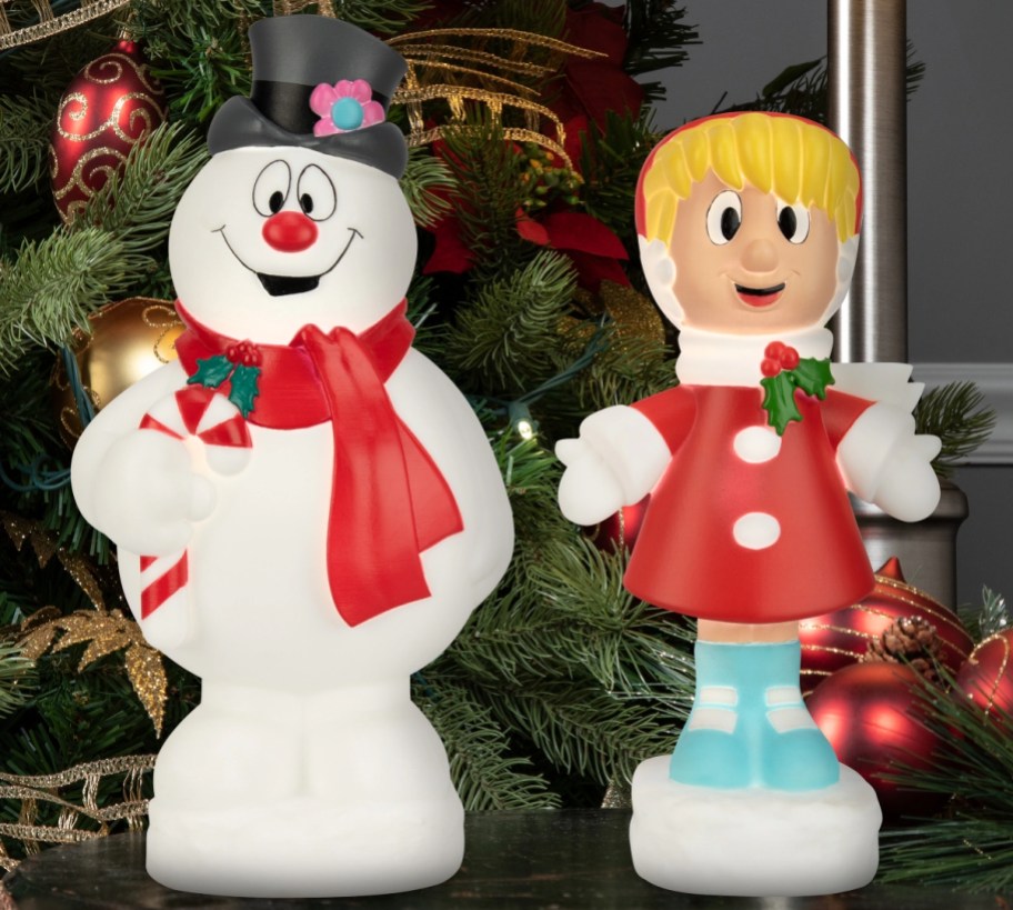frosty the snowman and Karen blowmolds on tabletop