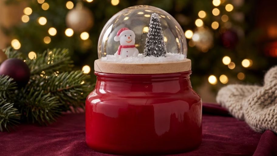 globe candle christmas house on top of the table