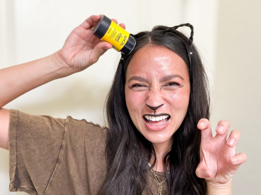 woman holding wax stick