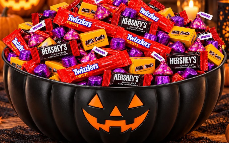 black pumpkin bowl full of candy 