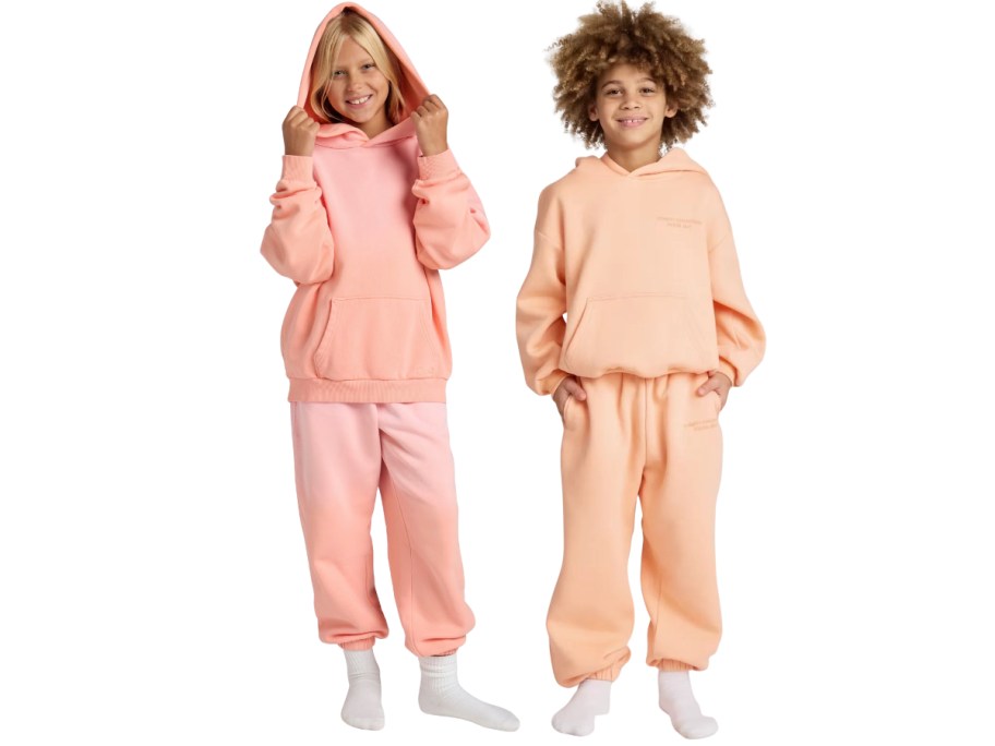 two kids wearing comfrt hoodies and joggers