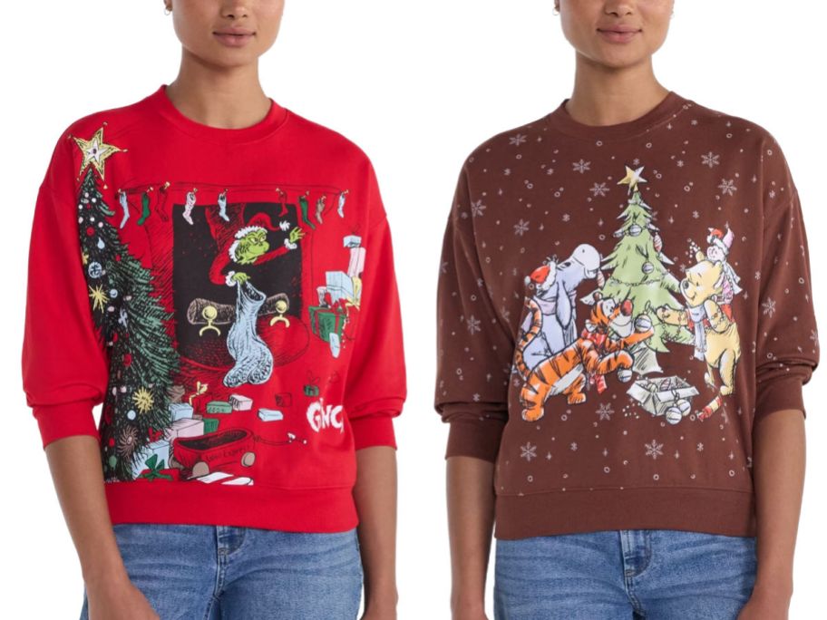 two women wearing Christmas sweatshirts on a white background