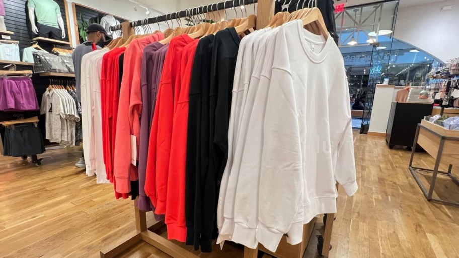 a rack of sweatshirts in a lululemon store