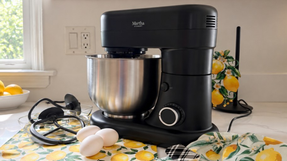 a dark gray stand mixer on a kitchen counter