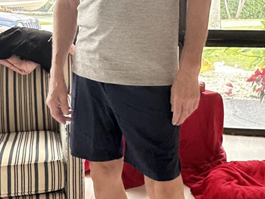 man wearing Amazon black shorts