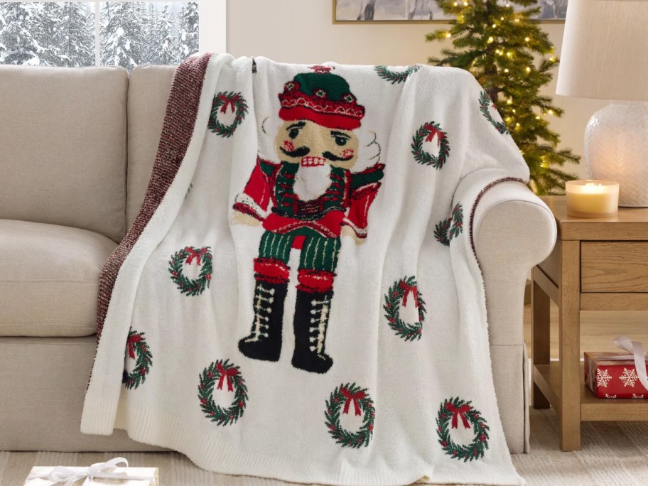 a nutcracker throw draped over a sofa