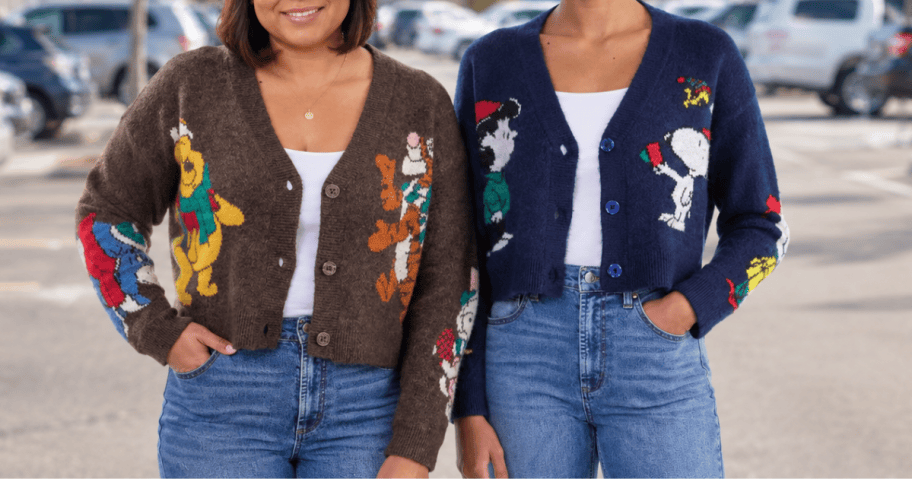 2 women wearing cardigans in a parking lot