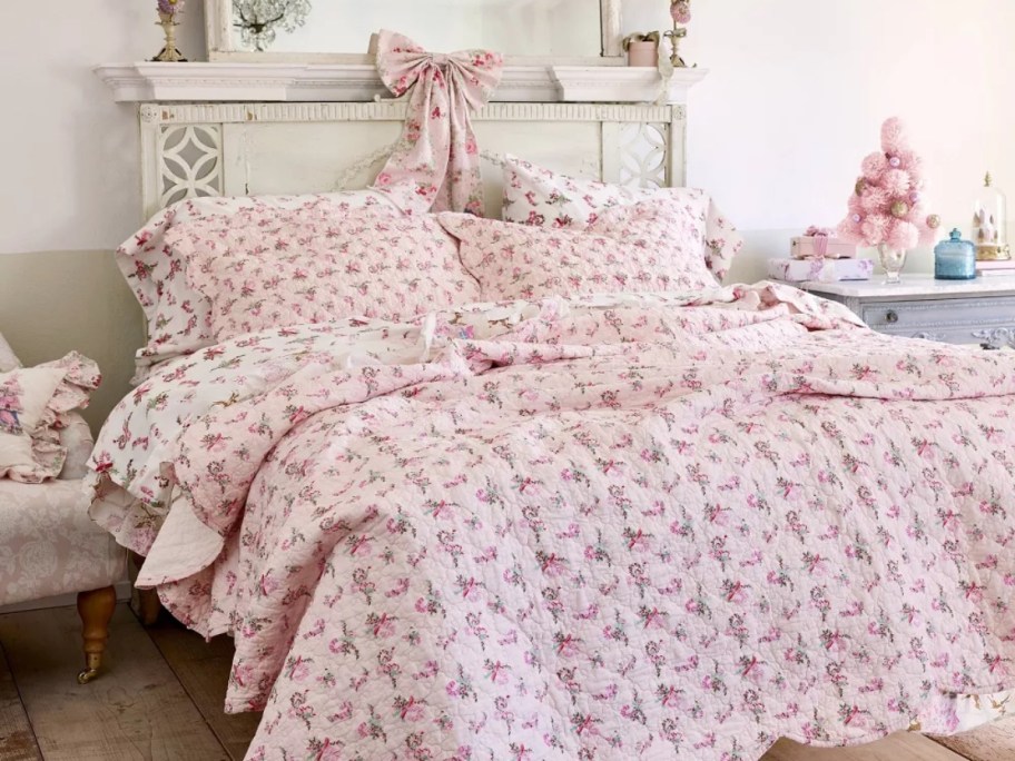 pink bedding on a white bed