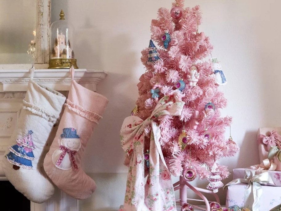 pink christmas tree next to pastel decor