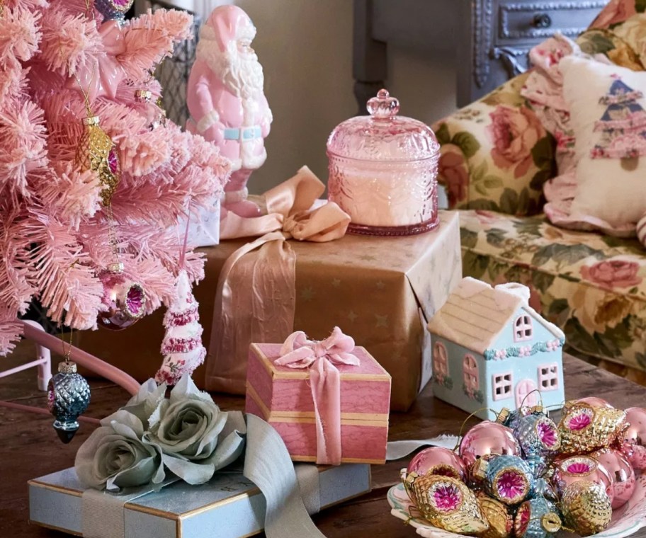 pastel Christmas decor on display under pink Christmas tree