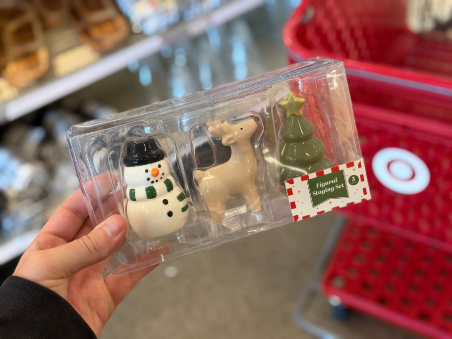 hand holding a set of christmas figures
