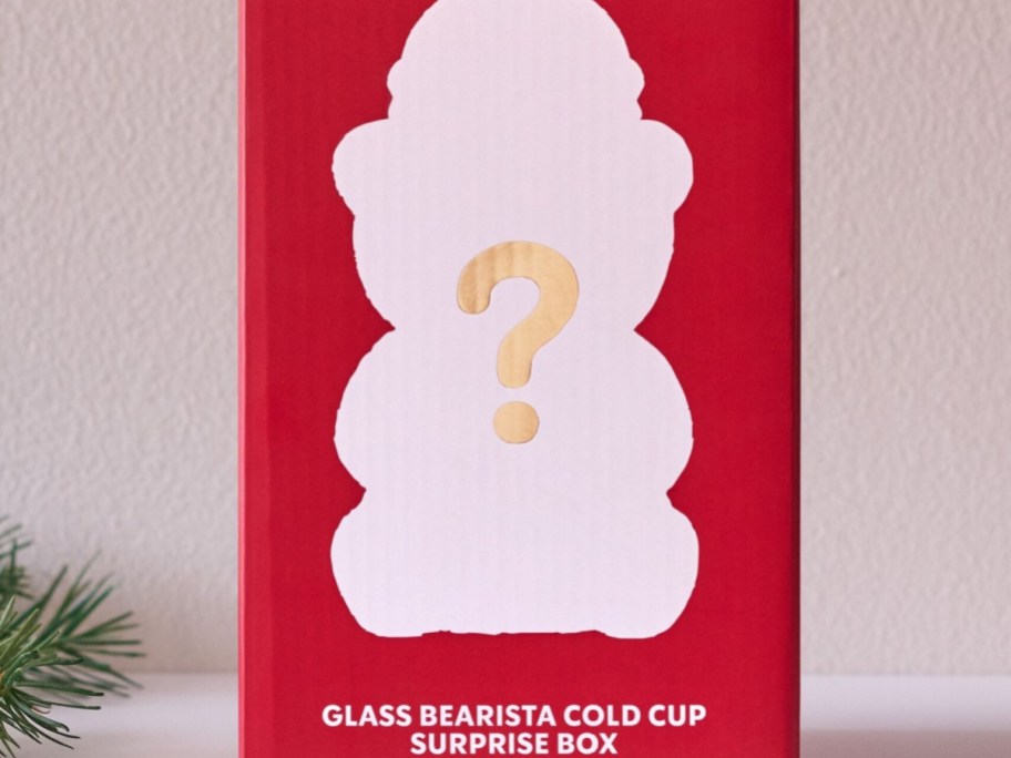 A red Starbucks Glass Bearista Cold Cup surprise box featuring a bear silhouette and a question mark on the front.