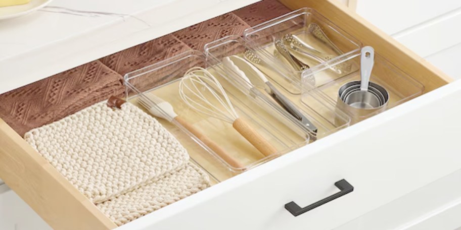 clear organizers with utensils in them