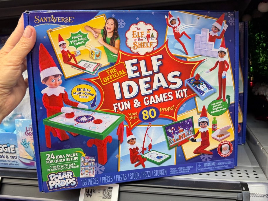 holding a box of Elf on the Shelf ideas