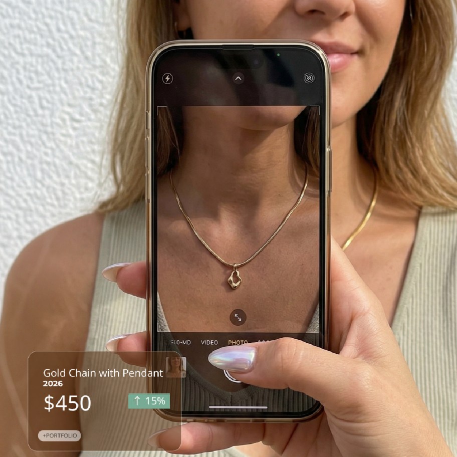 phone taking photo of womans necklace