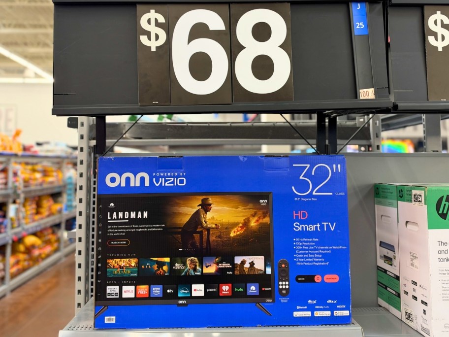 an onn TV in the box on a Walmart shelf with a price sign that says $68