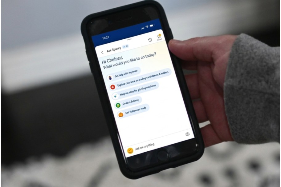 hand holding phone with walmart AI shopping tool