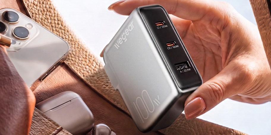 hand holding usb charging port 