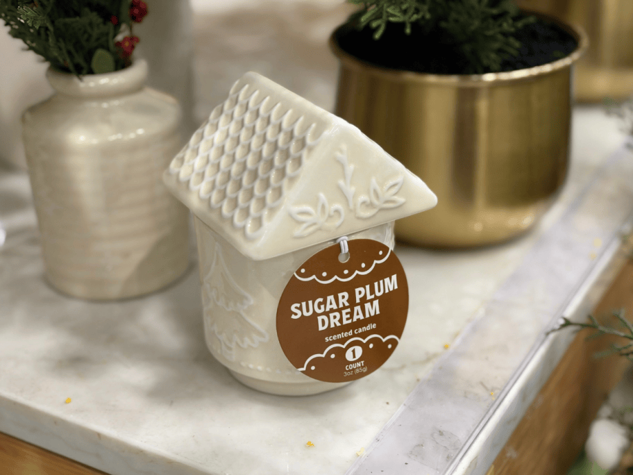 white gingerbread house candle