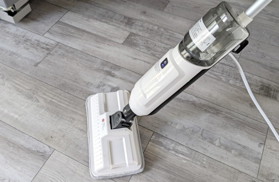 white and gray steam mop on tile 